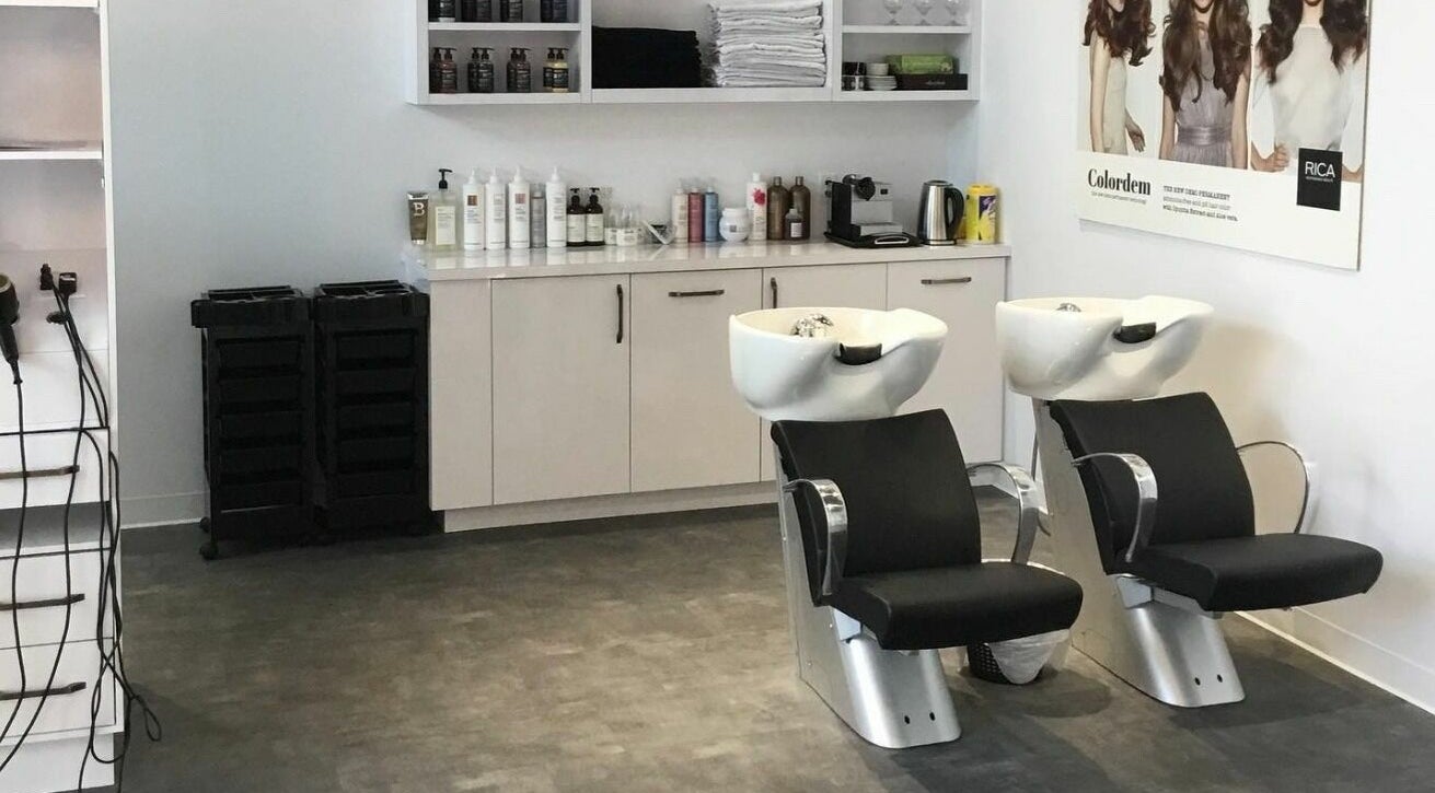 Modern hair washing station at Maneland in Ottawa, Ontario, CA, with sleek design and professional products.