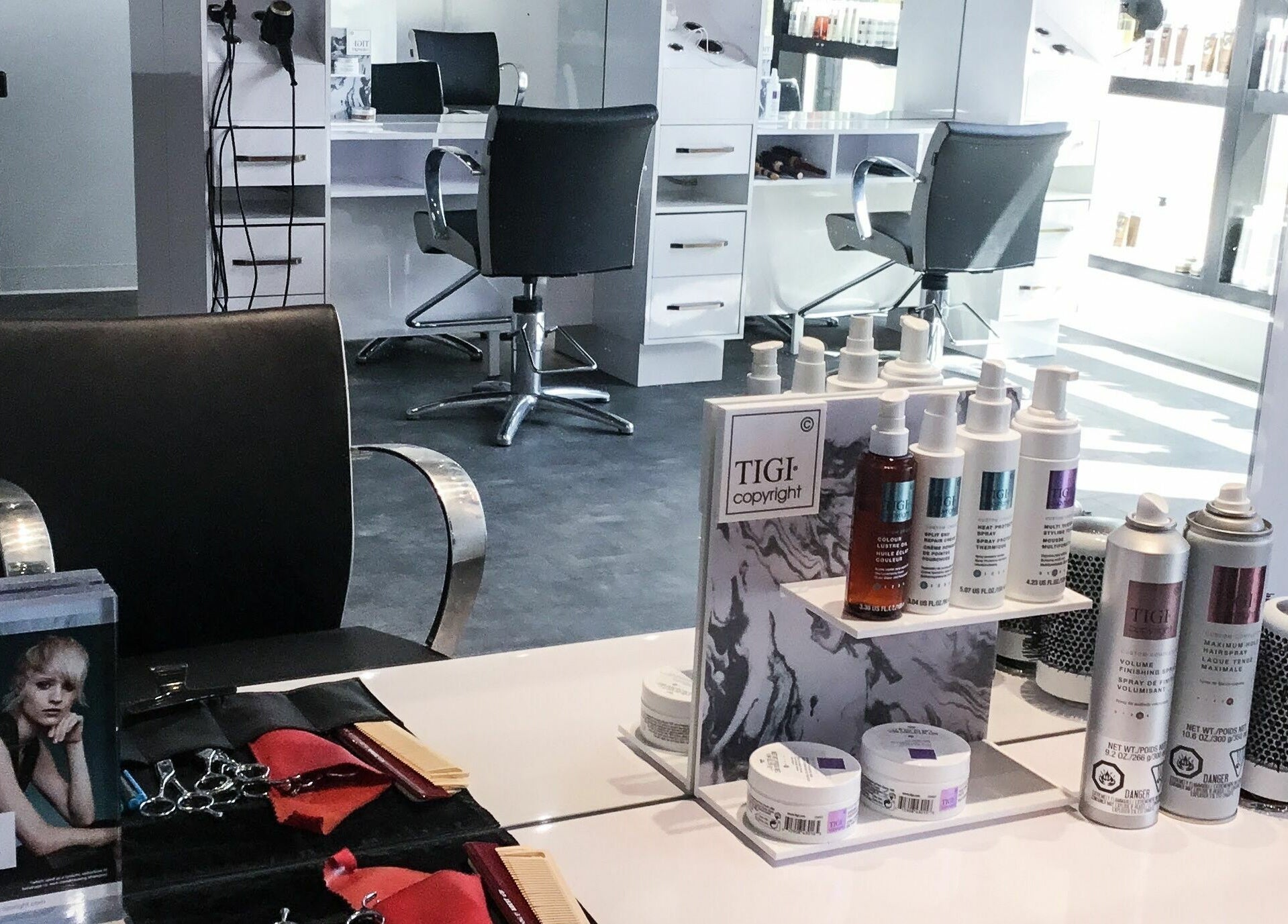 Chic salon station at Maneland, Ottawa, Ontario, CA, featuring elegant styling tools and products.