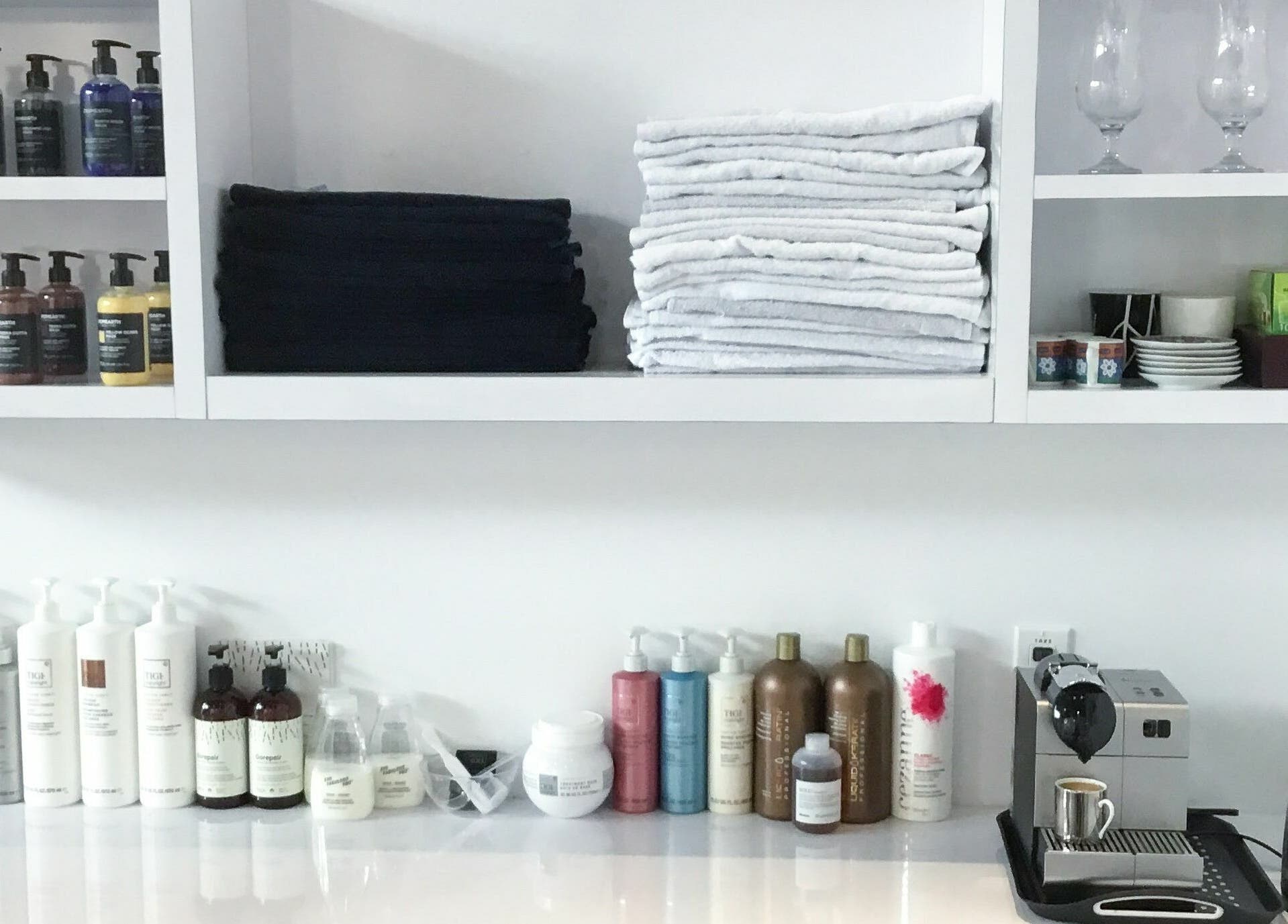 Maneland beauty supplies and towels in Ottawa, Ontario, CA on display for guest comfort.