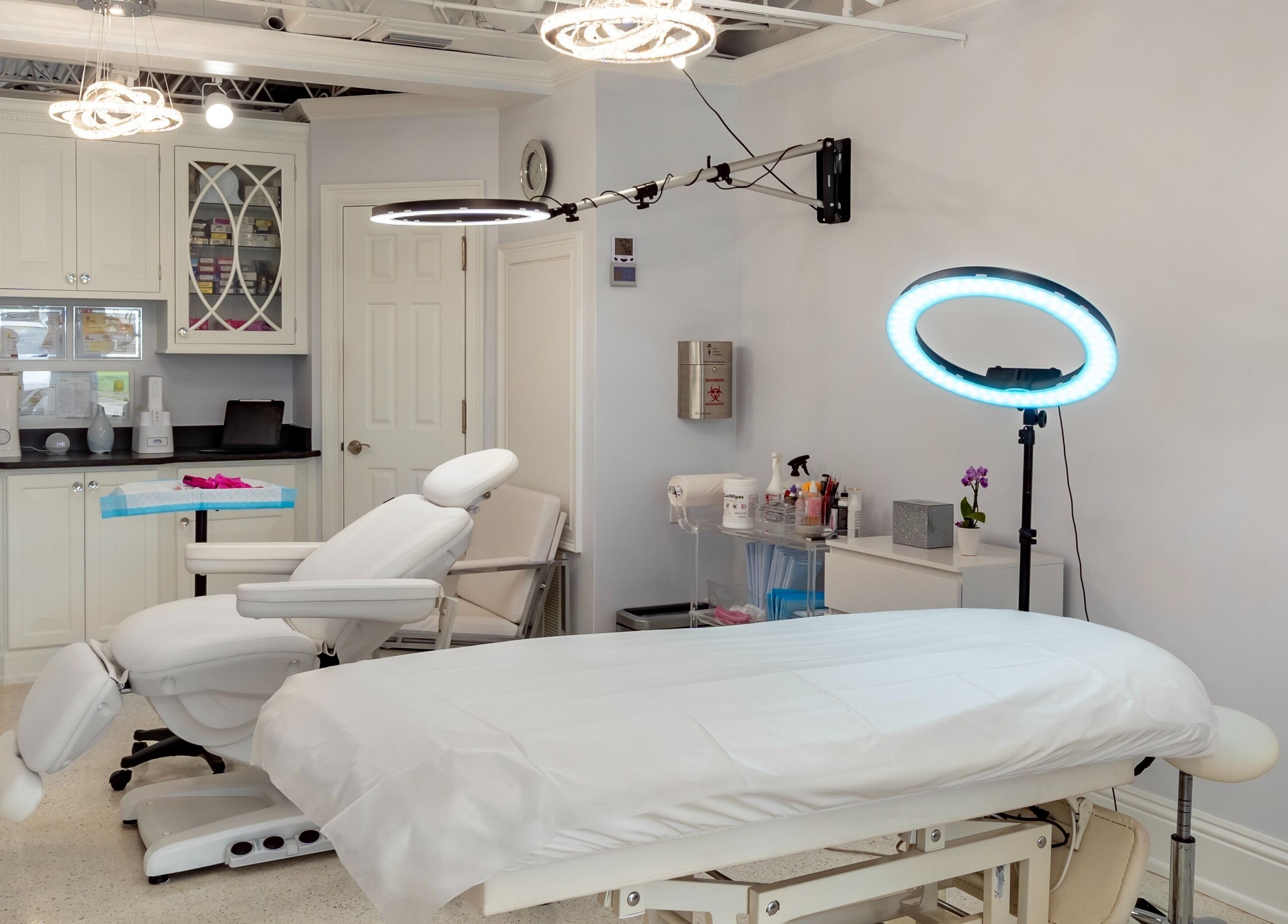Chic treatment room at By Pri, Vero Beach, Florida, US with modern equipment and ambient lighting.