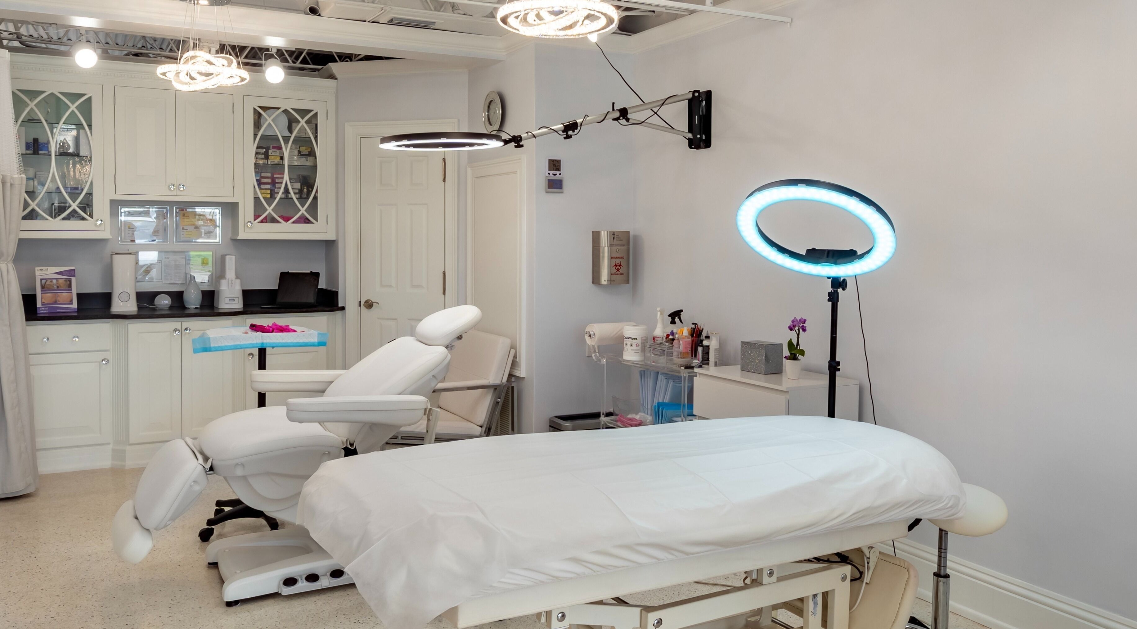 Chic treatment room at By Pri, Vero Beach, Florida, US with modern equipment and ambient lighting.