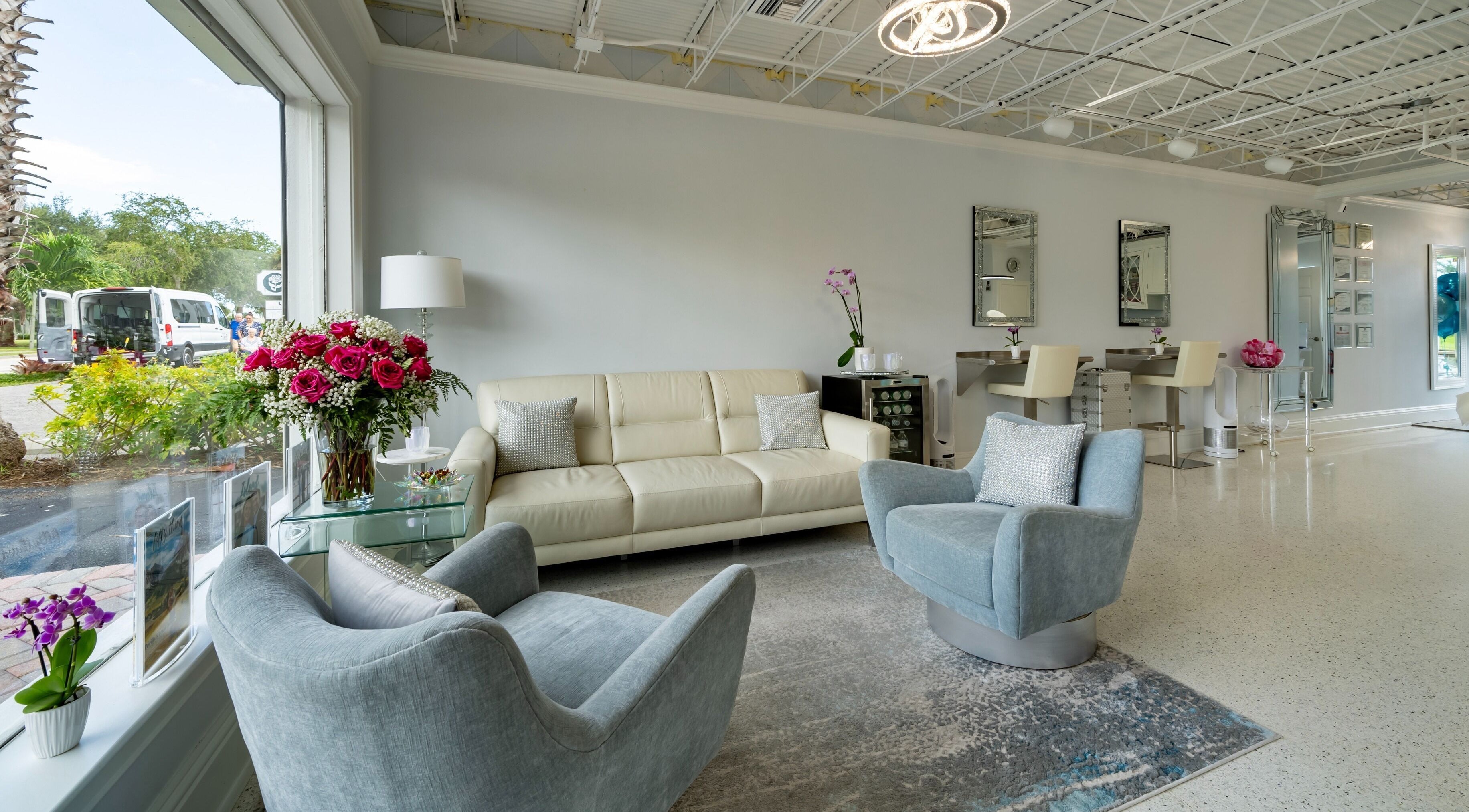 Modern lounge at By Pri, Vero Beach, Florida, US with elegant seating and floral decor.