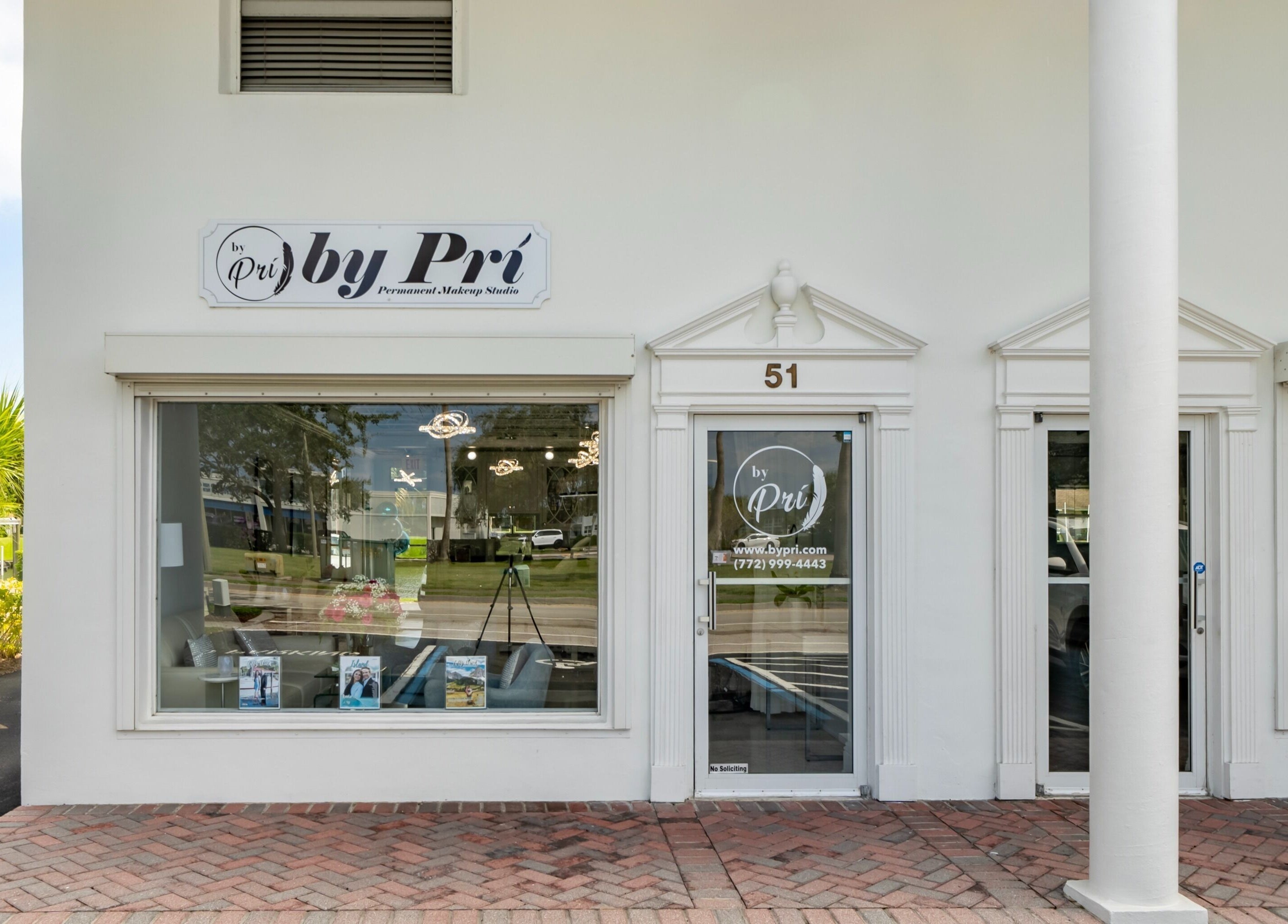 Front entrance of By Pri beauty studio in Vero Beach, Florida, showcasing sleek design and inviting ambiance.