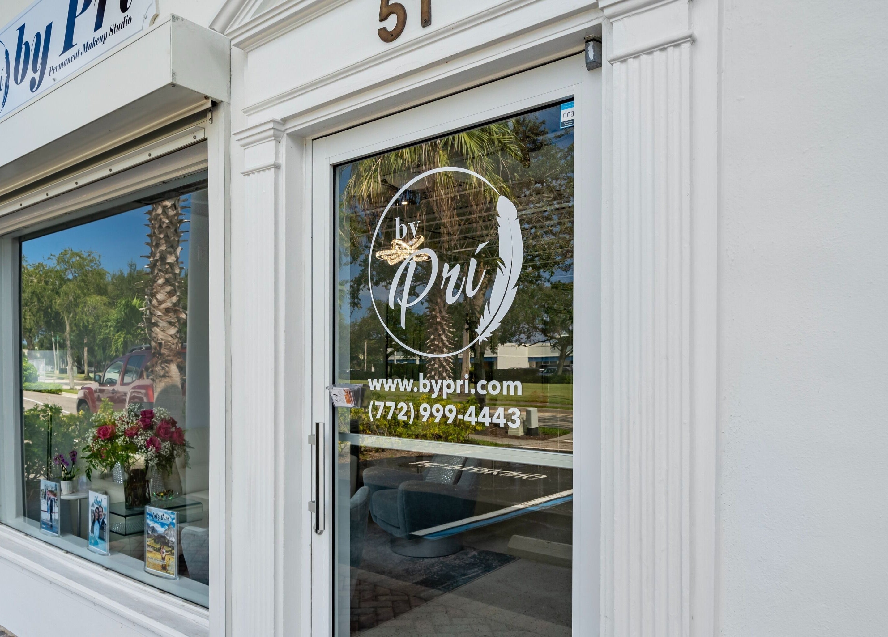Front view of By Pri in Vero Beach, Florida, US showcasing a modern entrance with elegant signage.