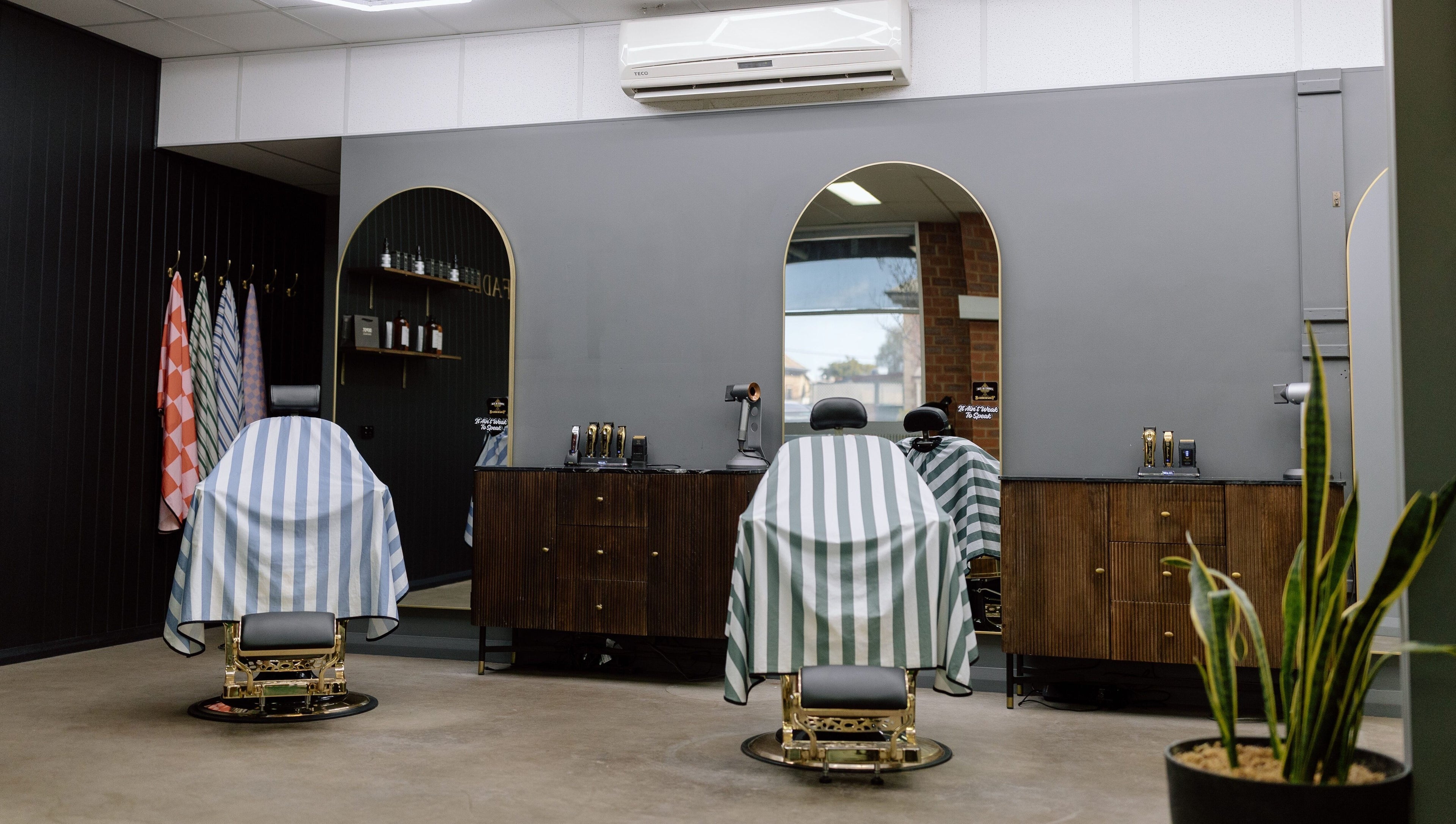 Luxurious barber chairs at Ace At Fades, Dubbo, New South Wales, AU showcasing sleek modern design.