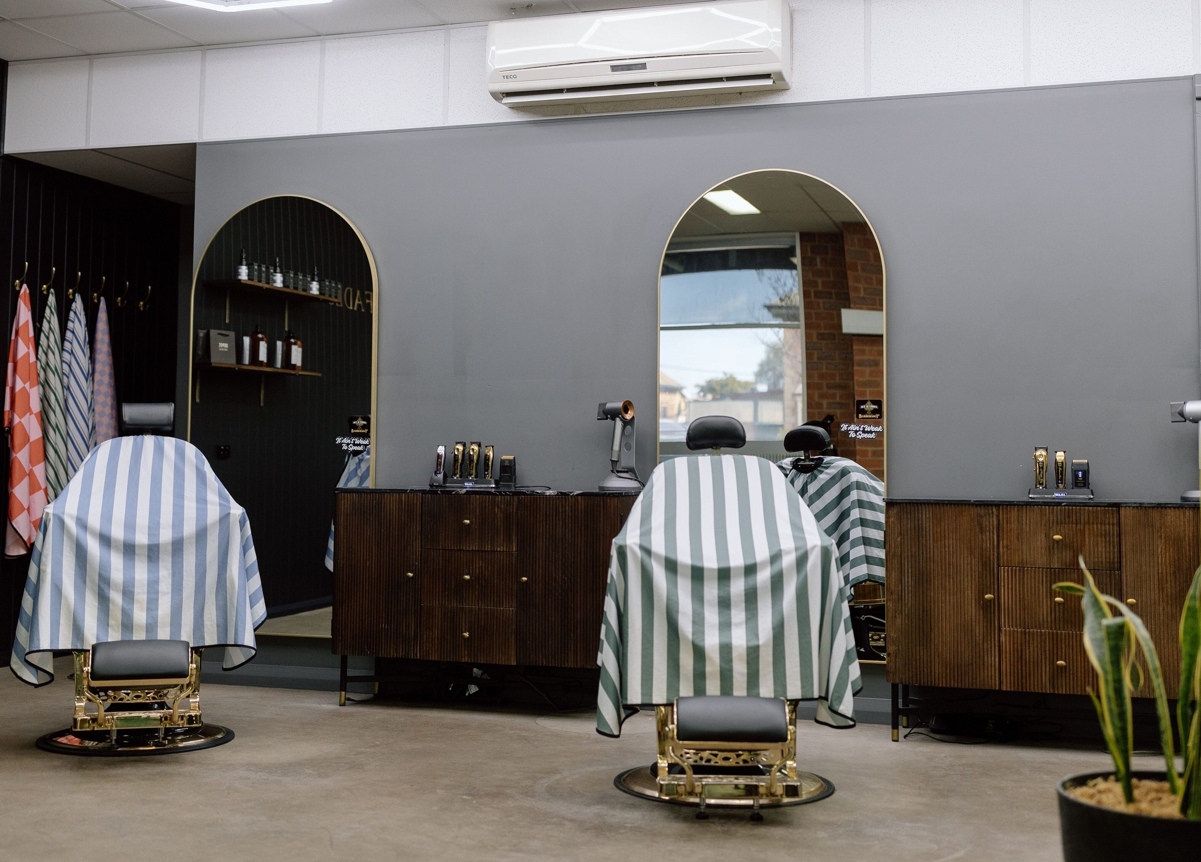 Luxurious barber chairs at Ace At Fades, Dubbo, New South Wales, AU showcasing sleek modern design.