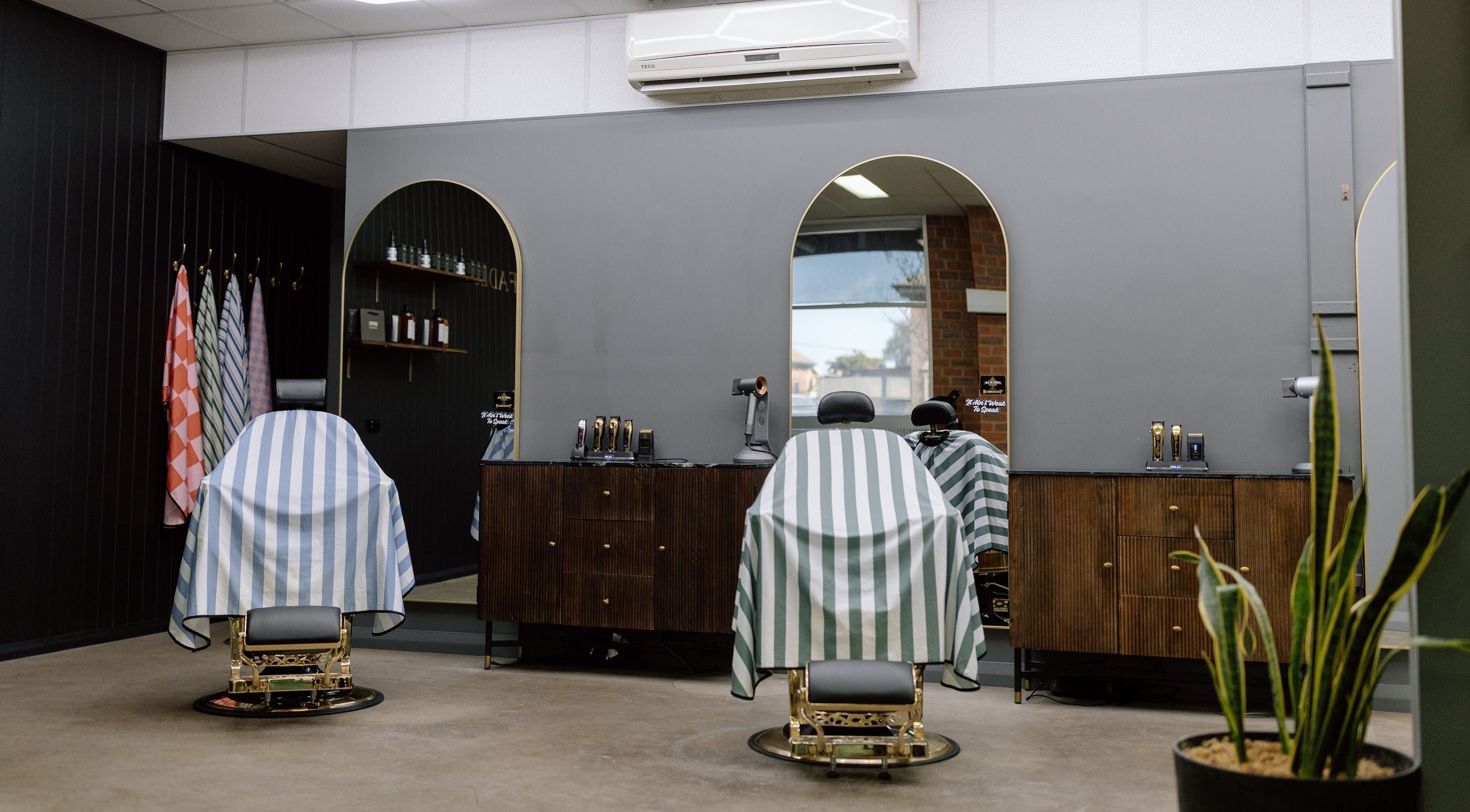 Luxurious barber chairs at Ace At Fades, Dubbo, New South Wales, AU showcasing sleek modern design.