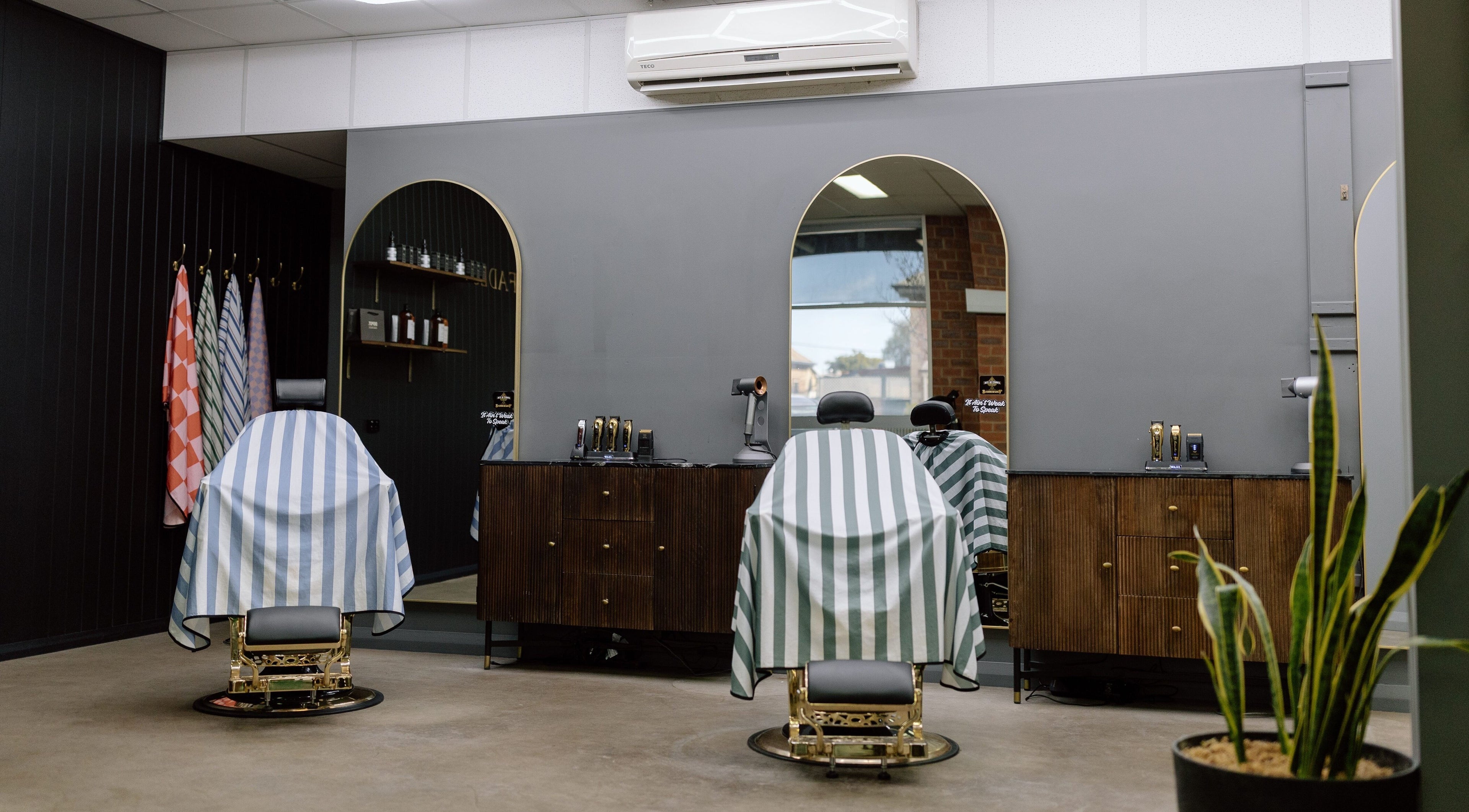Luxurious barber chairs at Ace At Fades, Dubbo, New South Wales, AU showcasing sleek modern design.