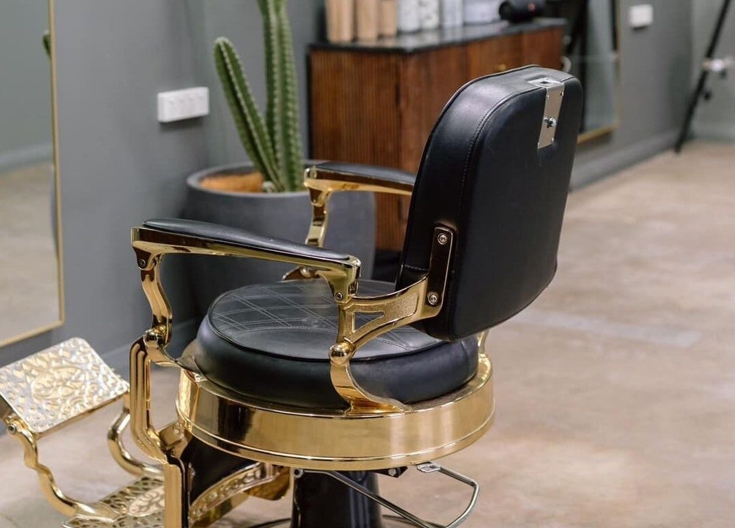 Luxurious salon chair at Ace At Fades, Dubbo, New South Wales, AU, showcasing modern interior style.