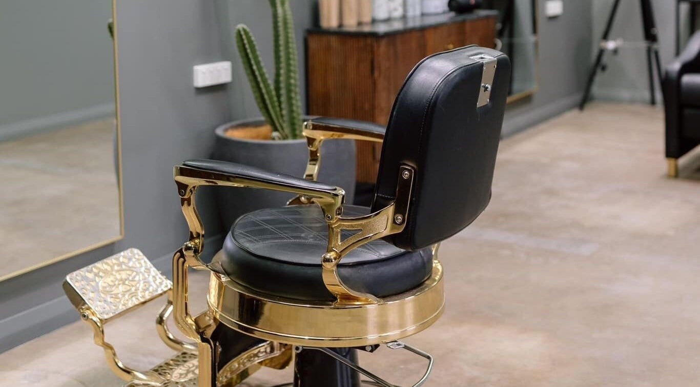 Luxurious salon chair at Ace At Fades, Dubbo, New South Wales, AU, showcasing modern interior style.