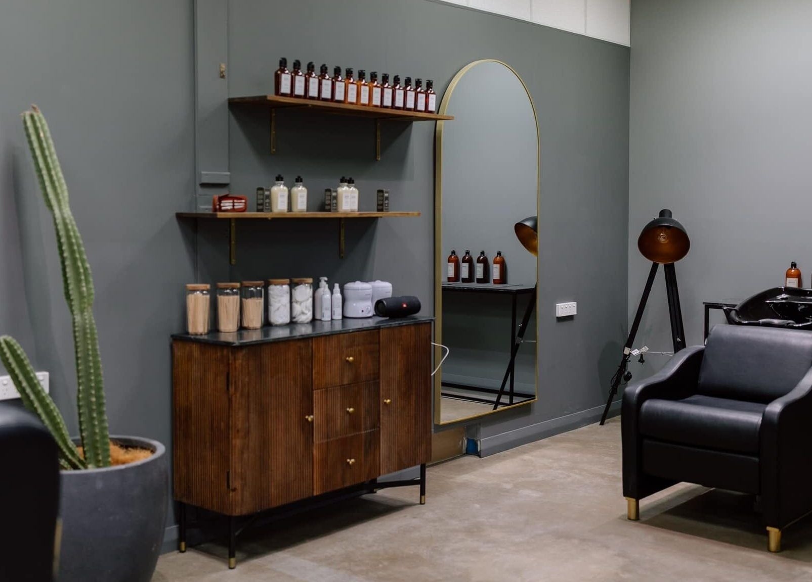 Modern salon interior at Ace At Fades, Dubbo, New South Wales, AU, featuring chic decor and beauty products.