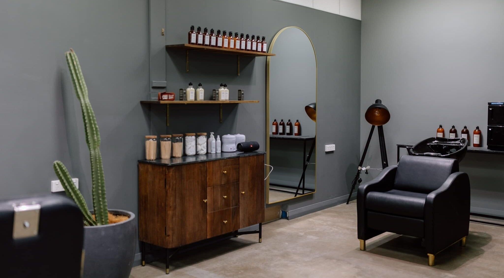 Modern salon interior at Ace At Fades, Dubbo, New South Wales, AU, featuring chic decor and beauty products.