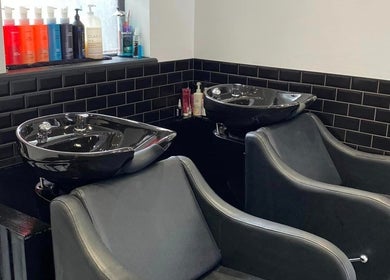 Modern wash stations at Atelier Hair & Beauty Studio in Bolton, England, GB.