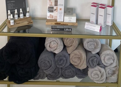 Luxurious products and towels at Atelier Hair & Beauty Studio in Bolton, England, GB.