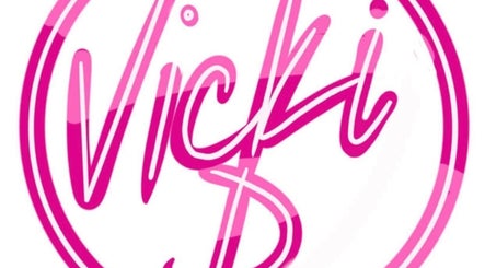 Vicki D logo in pink, symbolizing beauty and wellness in Hoylake, England, GB.