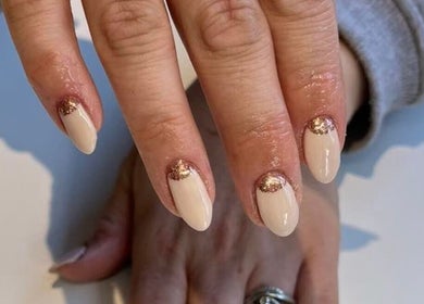 Stylish nude nails with glitter at Peak Perfection, Braintree, England, GB.