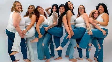 Team at Bella Rose Hair Artistry, Logansport, Indiana, US, sharing a fun moment in white tops and jeans.