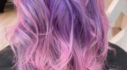 Vibrant pink and purple hair styled at Bella Rose Hair Artistry, Logansport, Indiana, US.