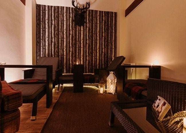 Peaceful lounge area at Reading Room Day Spa in Lewes, England, GB with ambient lighting and comfortable seating.