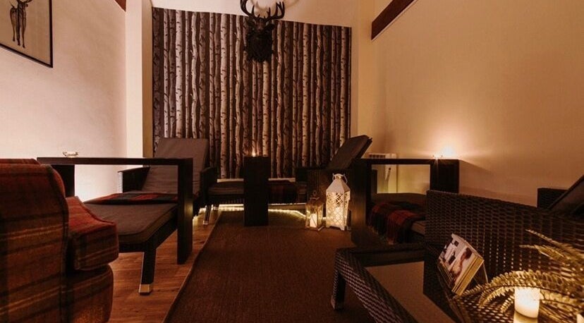 Peaceful lounge area at Reading Room Day Spa in Lewes, England, GB with ambient lighting and comfortable seating.