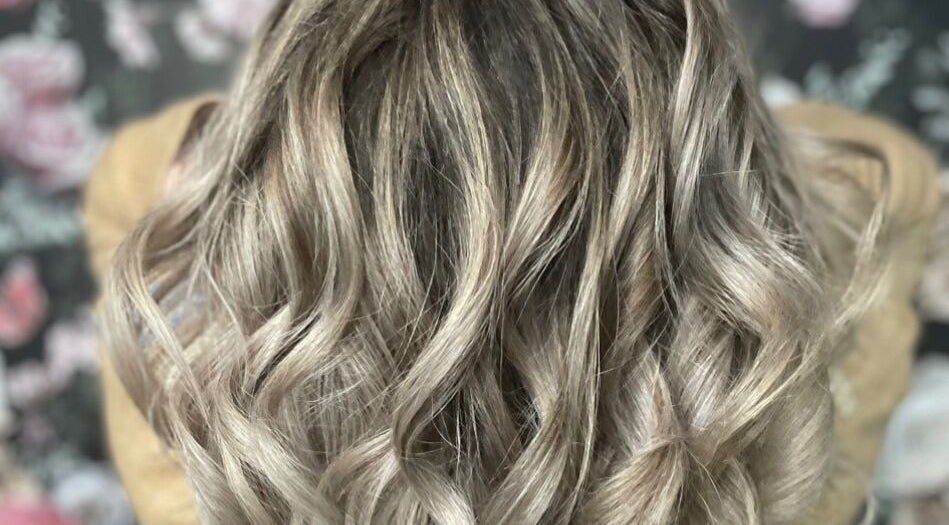 Blonde wavy hairstyle at Hair and Aesthetic Innovations MK, Milton Keynes, England, GB.