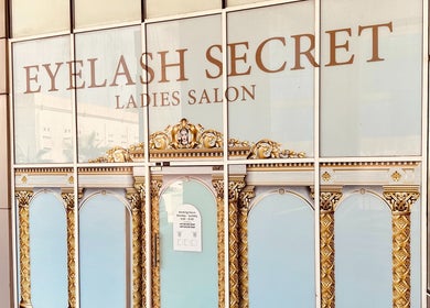 Entrance of Eyelash Secret Ladies Salon Damac Voleo in Dubai, AE, showcasing ornate gold design and signage.