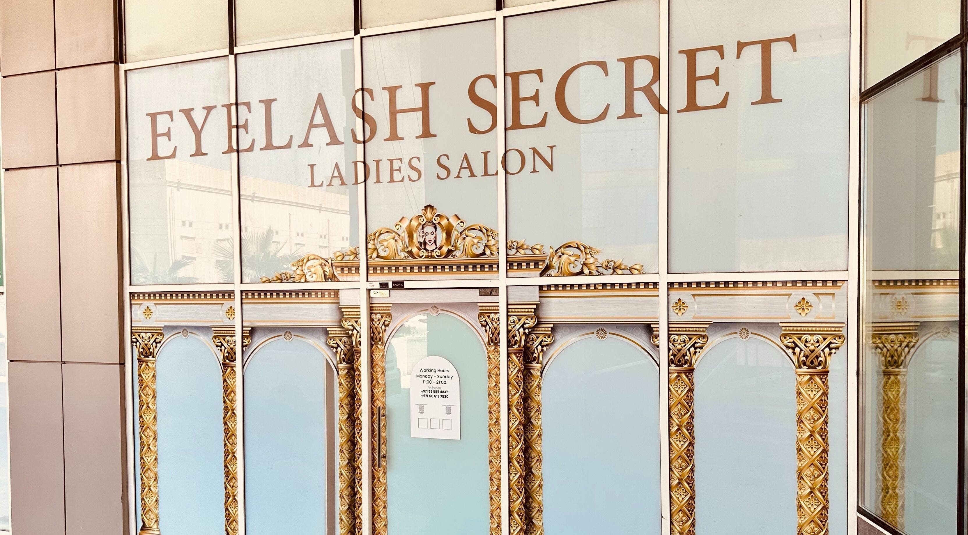 Entrance of Eyelash Secret Ladies Salon Damac Voleo in Dubai, AE, showcasing ornate gold design and signage.