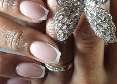 Elegant manicure featuring French tips at Eyelash Secret Ladies Salon Iris Bay, Dubai, Dubai, AE.