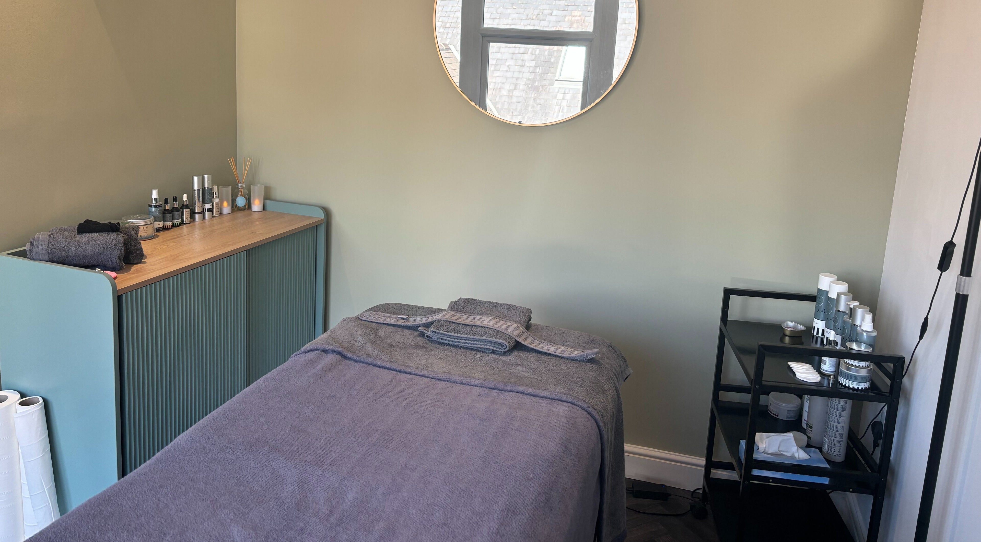 Relaxing treatment room at Butterfly Beauty, Wakefield, England, GB, featuring a cozy massage bed and calming decor.