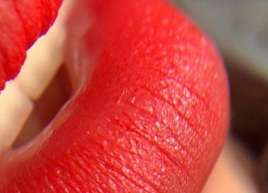 Close-up of vibrant red lips at VitaBrows PMU & Lash in Miami, Florida, US.