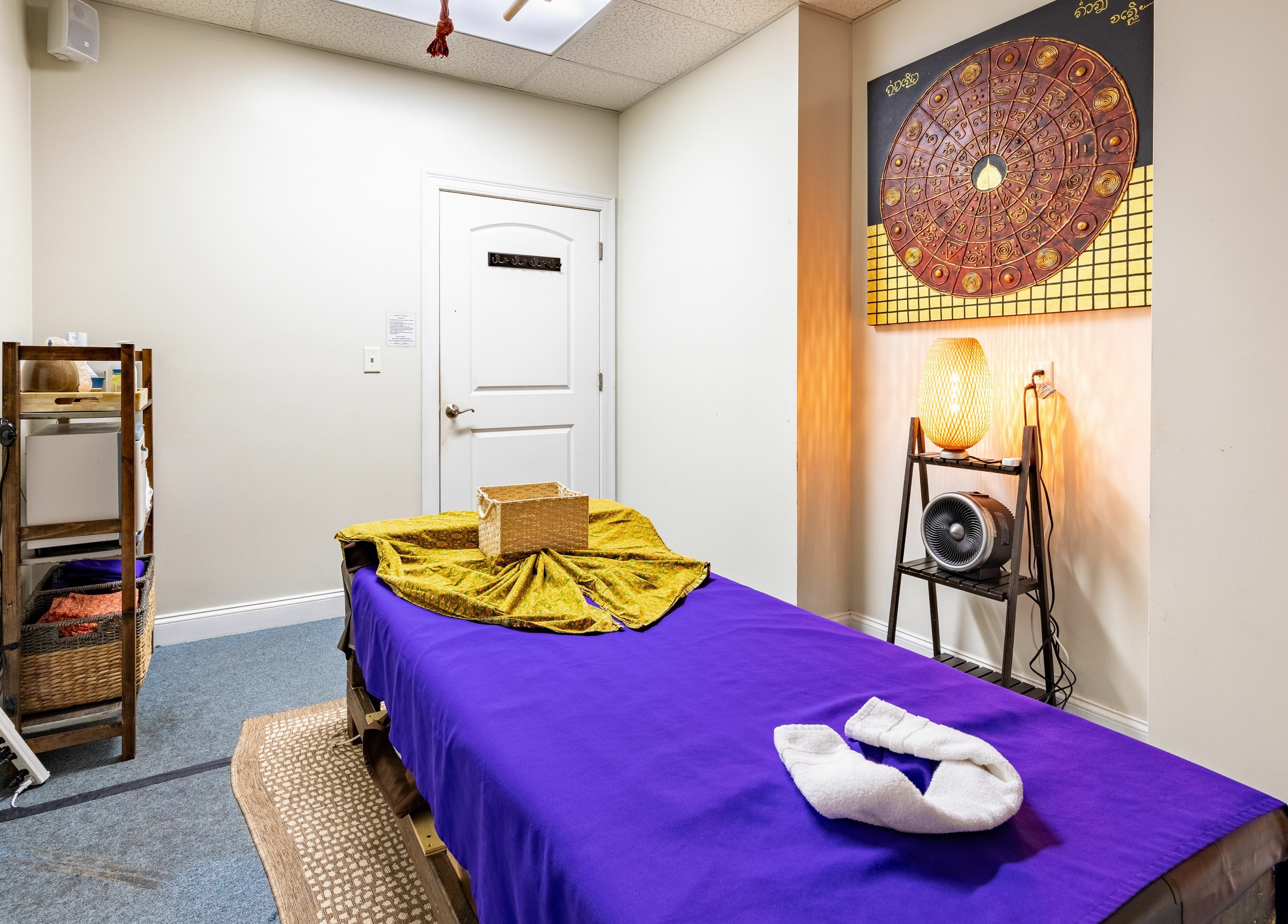 Massage room at La Moon Thai Spa Wilmington, featuring cozy decor in Wilmington, Massachusetts, US.