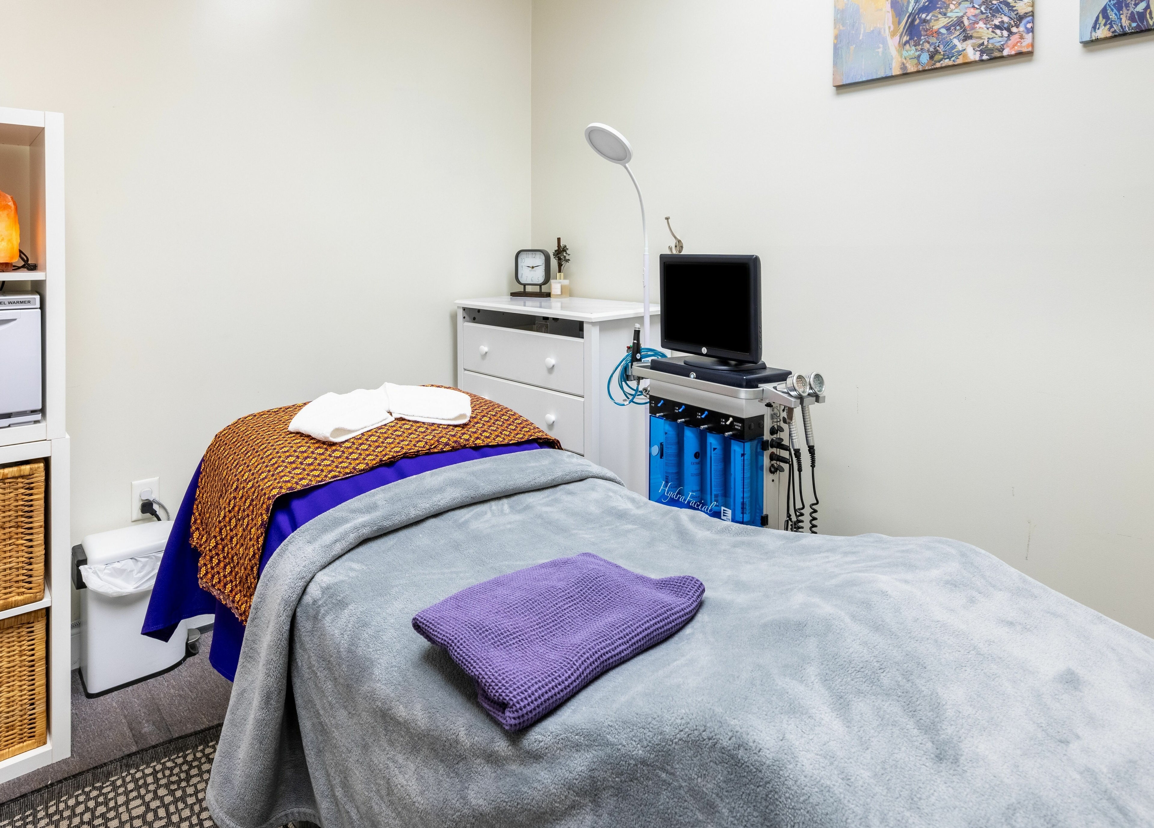 Cozy massage room at La Moon Thai Spa Wilmington, Massachusetts, US with soft lighting and warm decor.