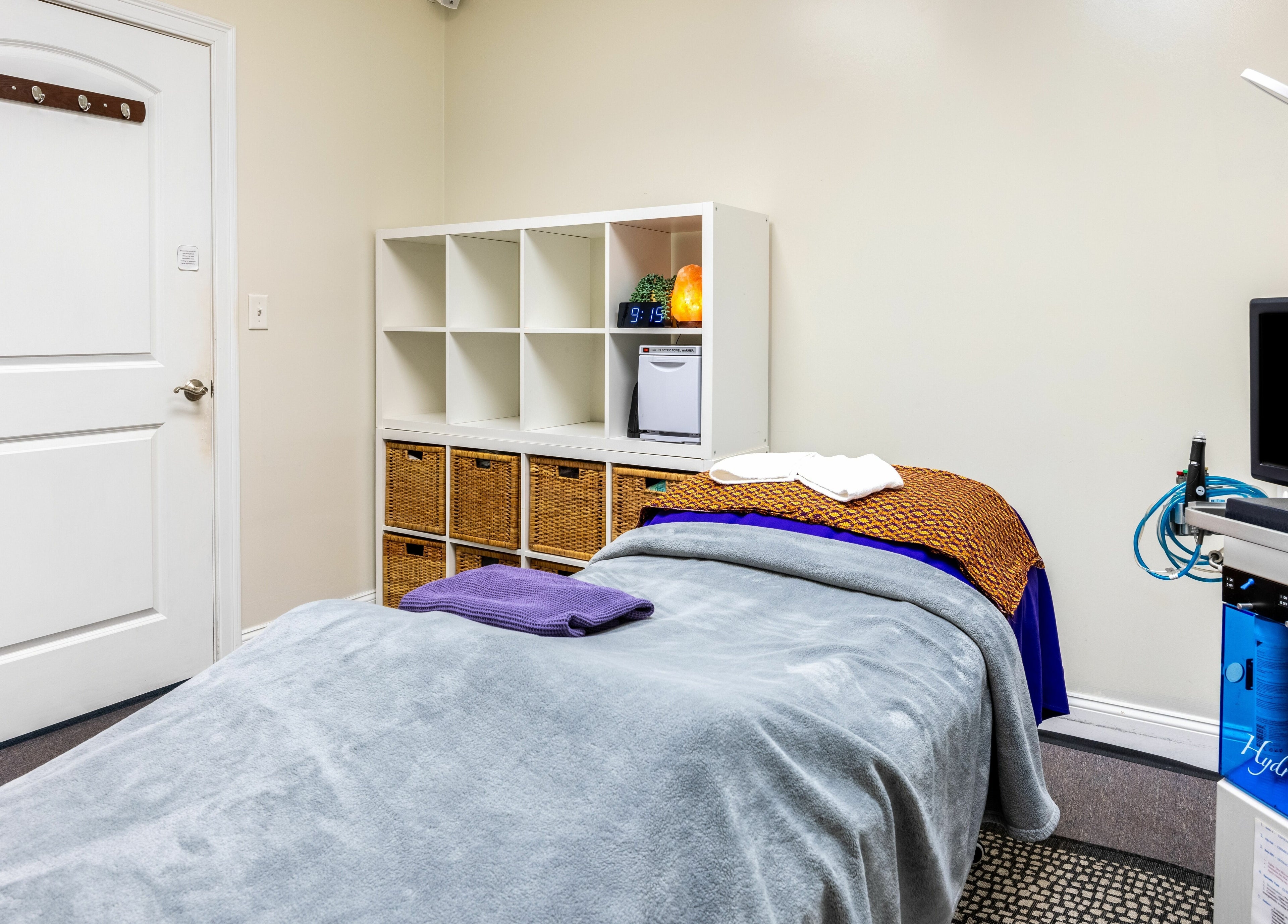 Cozy treatment room at La Moon Thai Spa Wilmington, Massachusetts, US with soothing decor and equipment.