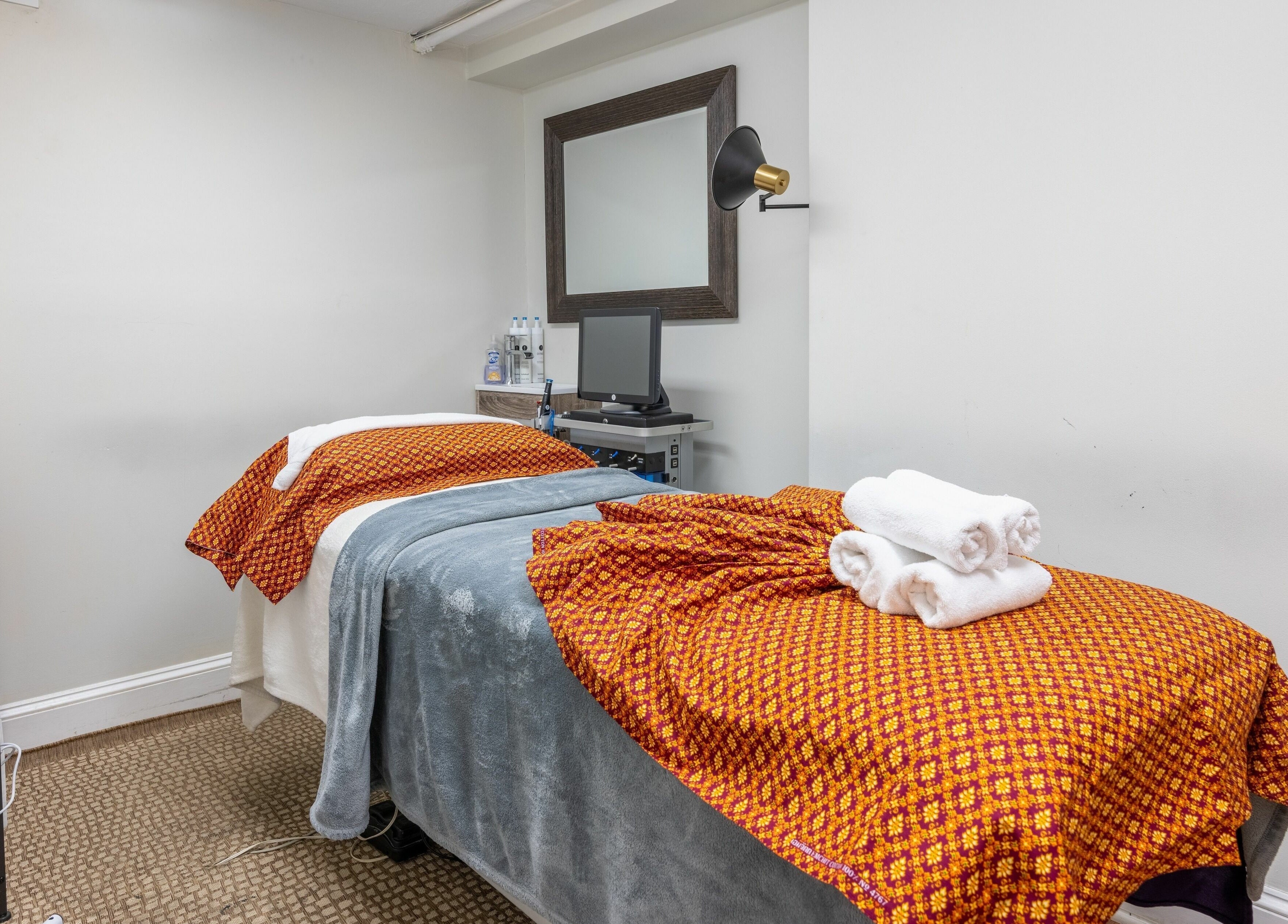 Cozy massage room at La Moon Thai Spa Cambridge with a treatment table and warm decor in Cambridge, Massachusetts, US.