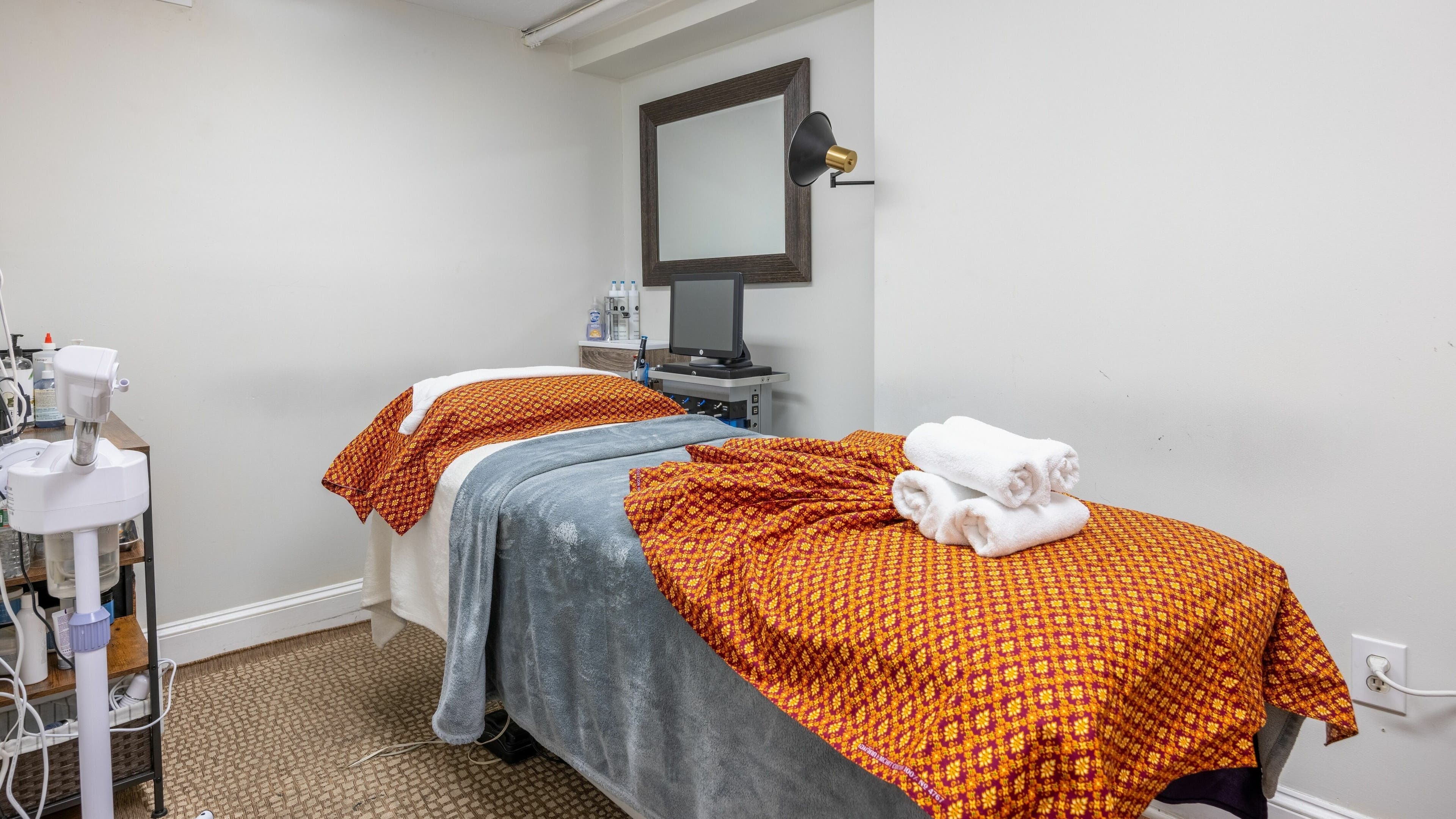 Cozy massage room at La Moon Thai Spa Cambridge with a treatment table and warm decor in Cambridge, Massachusetts, US.