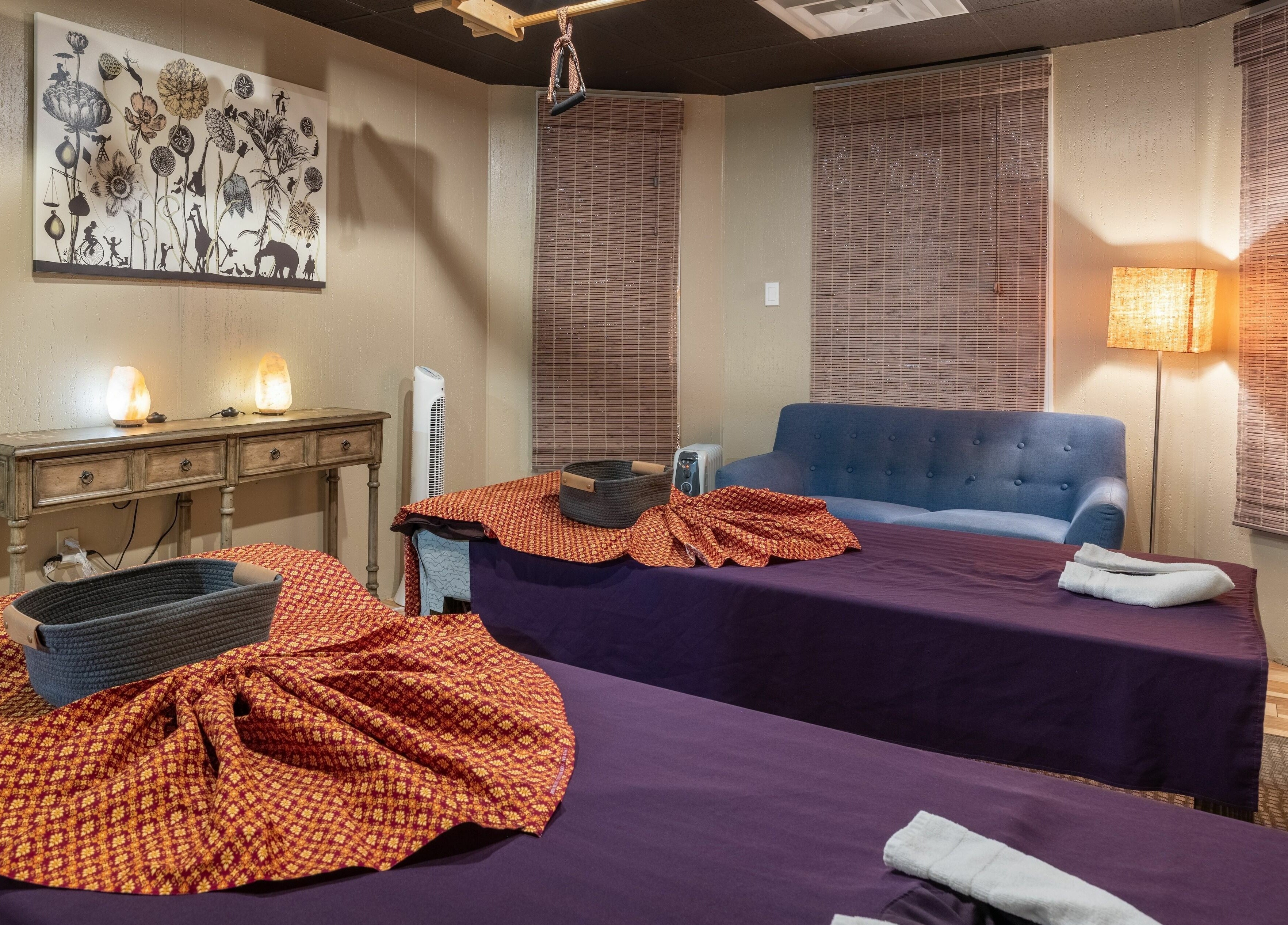 Elegant massage room at La Moon Thai Spa Cambridge, Massachusetts, US with cozy beds and soft lighting.