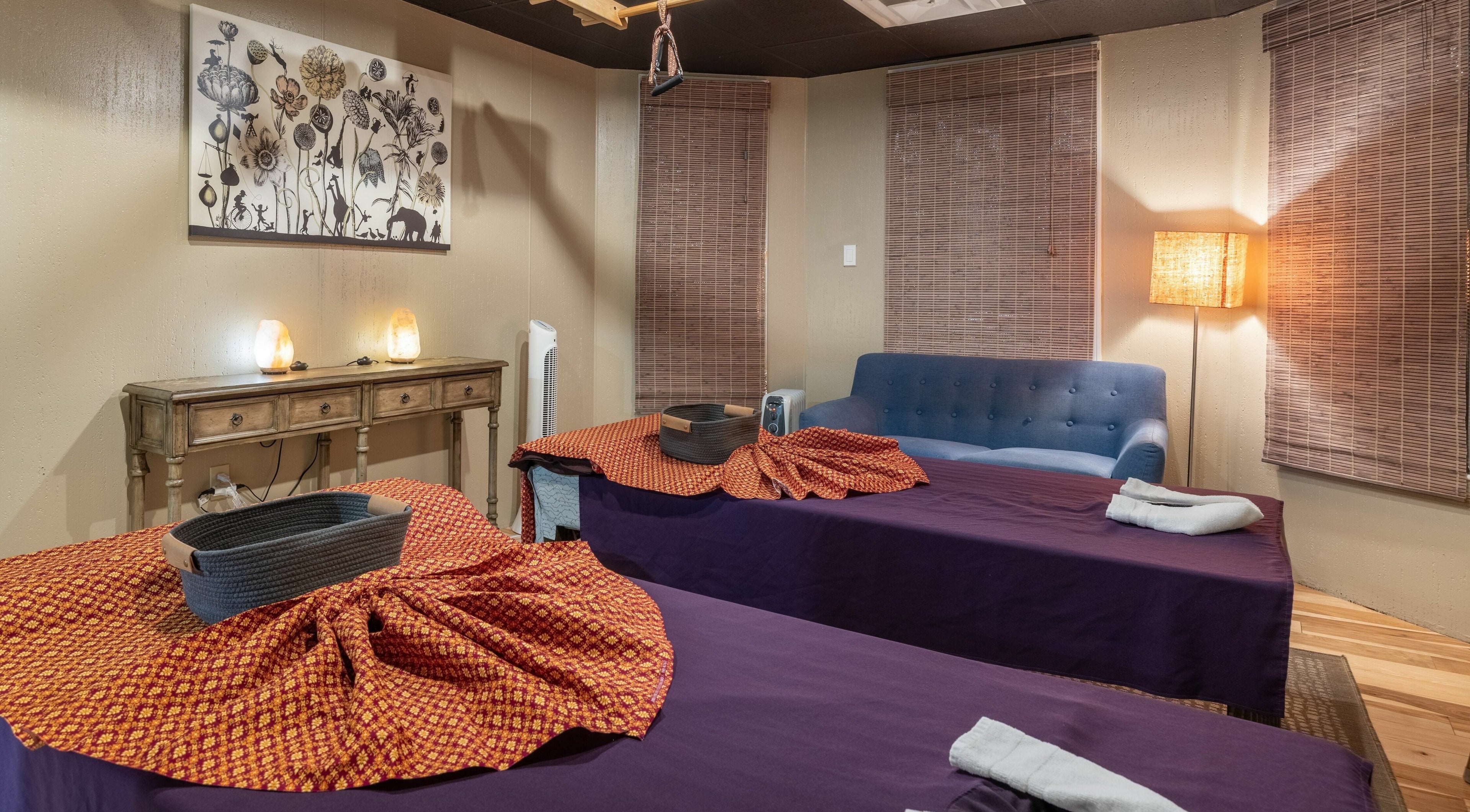 Elegant massage room at La Moon Thai Spa Cambridge, Massachusetts, US with cozy beds and soft lighting.