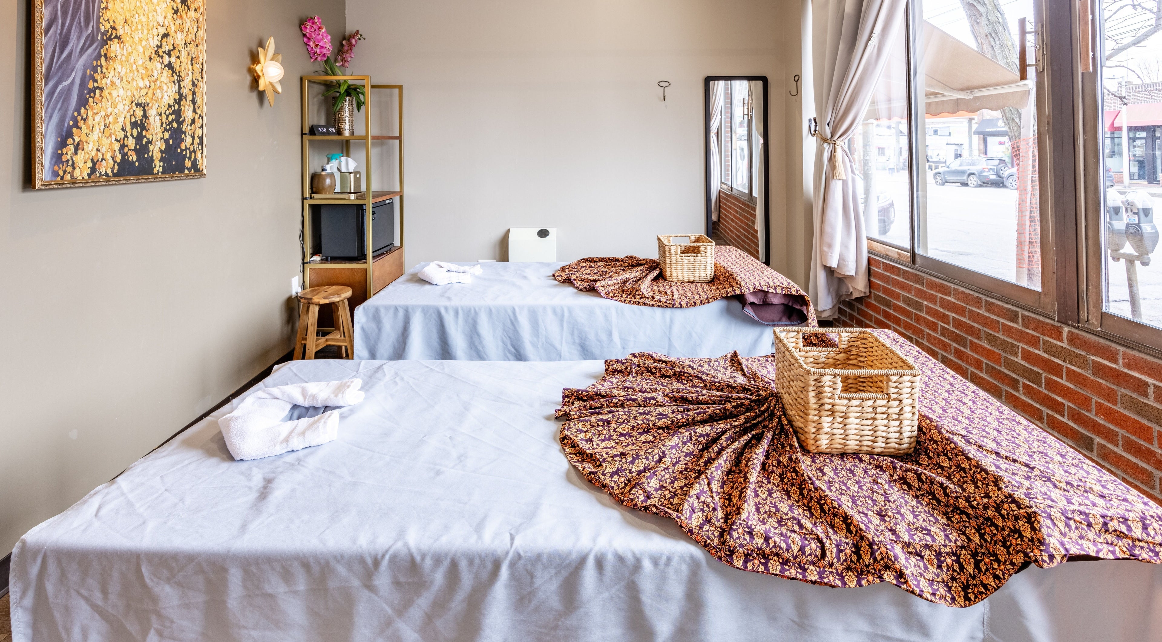 Relaxing massage room at Praan Thai Massage, Watertown, Massachusetts, US with elegant decor and cozy setting.