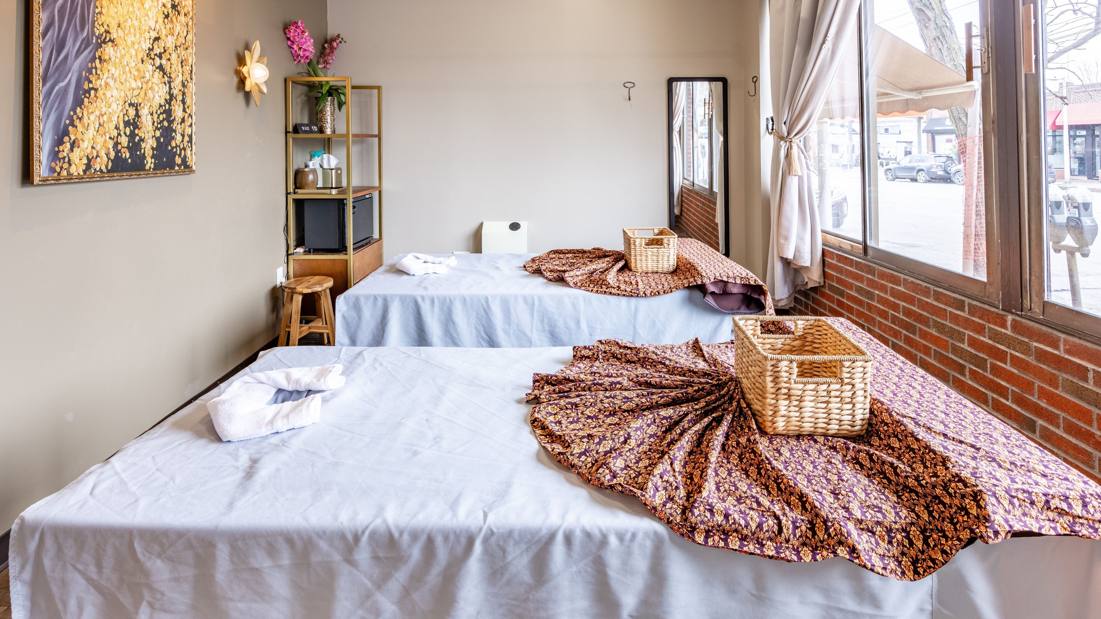 Relaxing massage room at Praan Thai Massage, Watertown, Massachusetts, US with elegant decor and cozy setting.