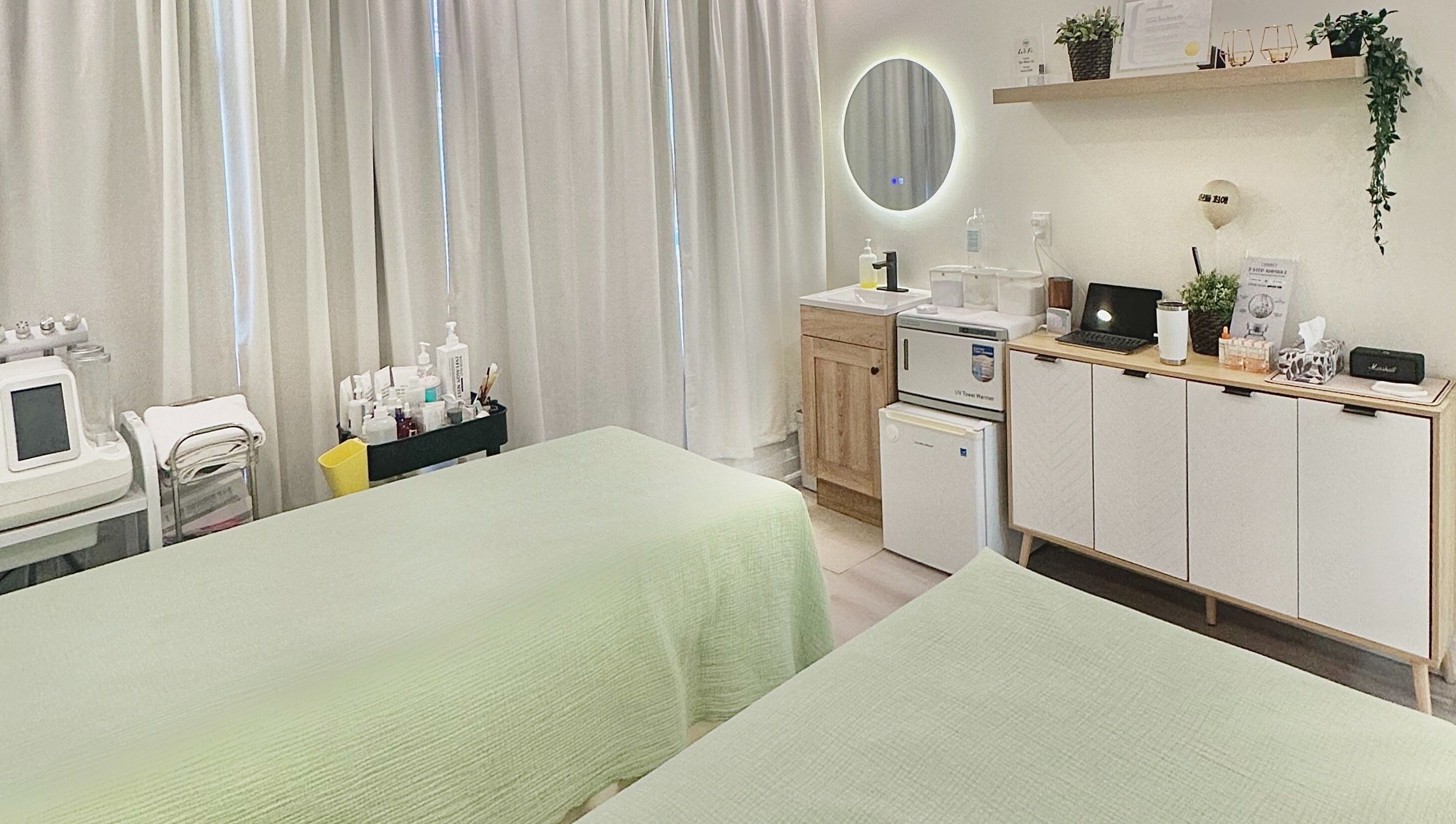 Tranquil spa room with twin beds at SPAMUZE, Toronto, Ontario, CA, offering a serene wellness experience.