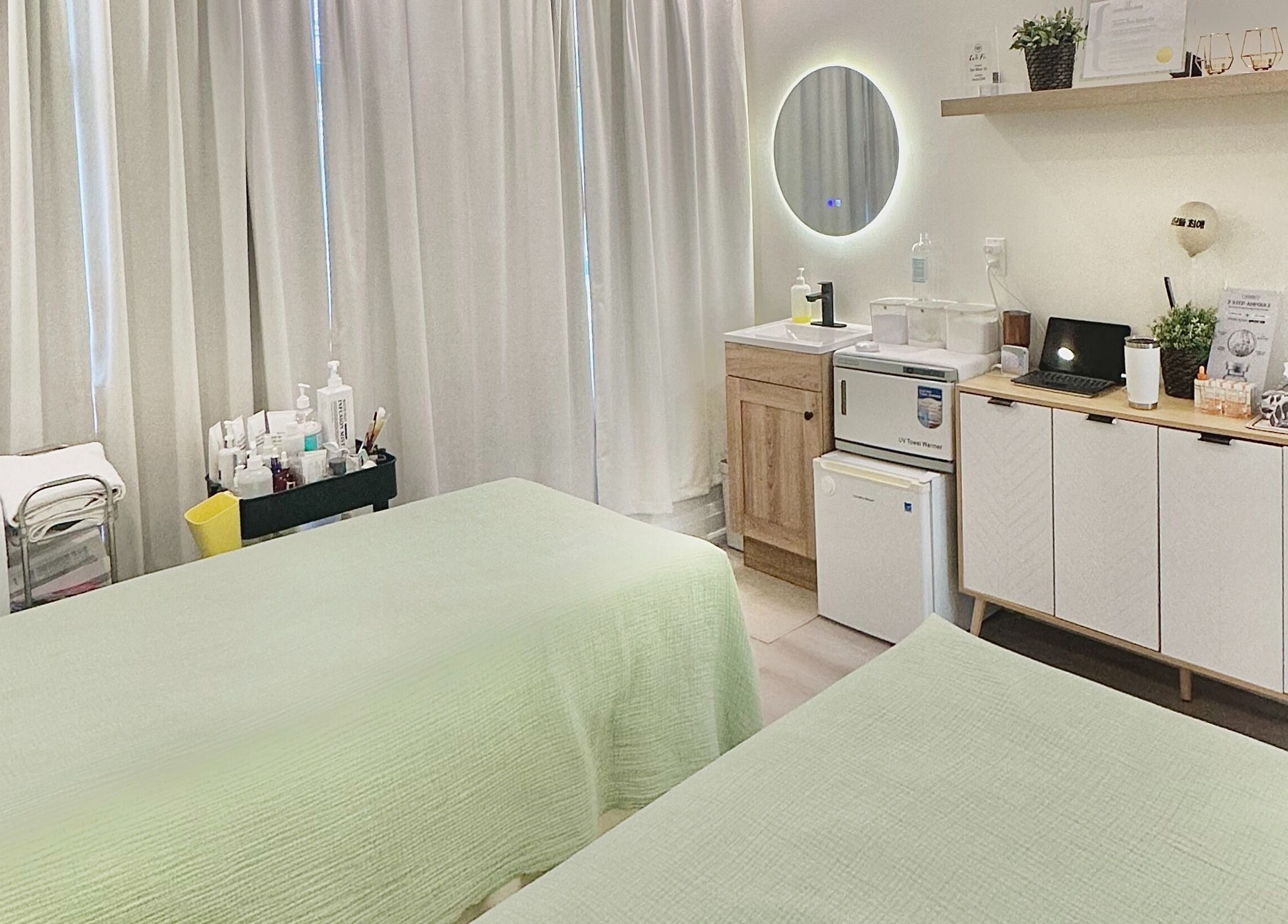 Tranquil spa room with twin beds at SPAMUZE, Toronto, Ontario, CA, offering a serene wellness experience.