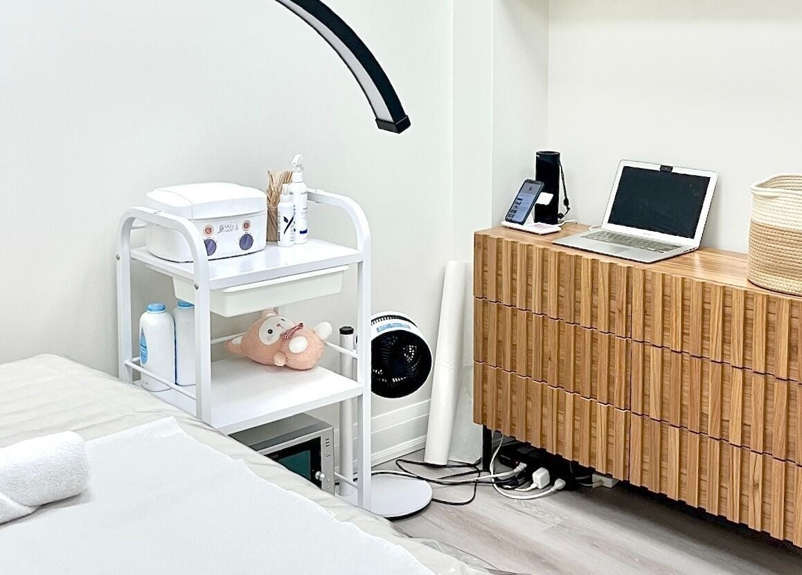 Relaxing treatment room at SPAMUZE, Toronto, Ontario, CA featuring a massage table and soothing decor.
