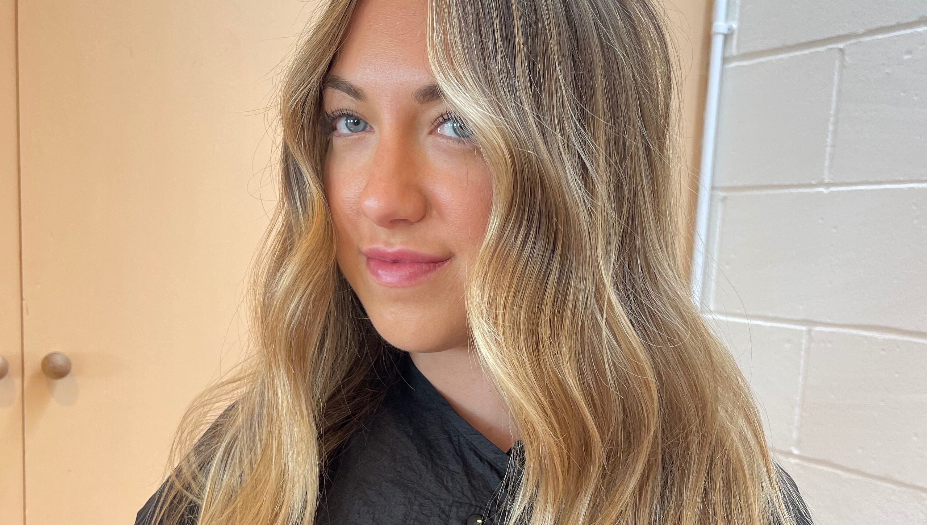 Woman with long, wavy blonde hair at Imogen Coates, London, England, GB.