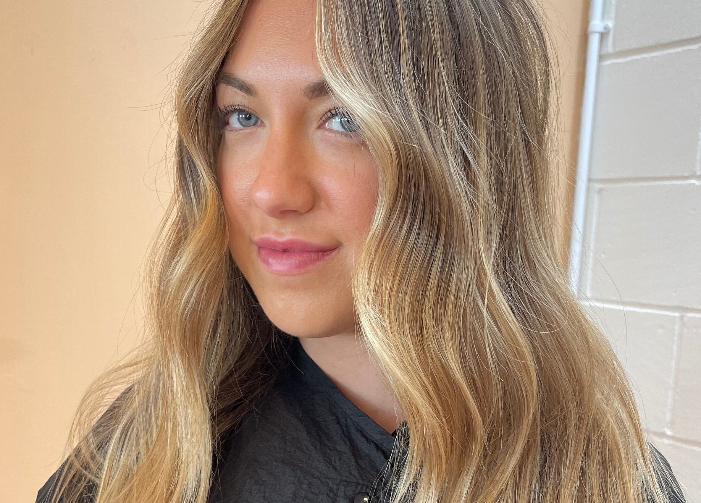 Woman with long, wavy blonde hair at Imogen Coates, London, England, GB.