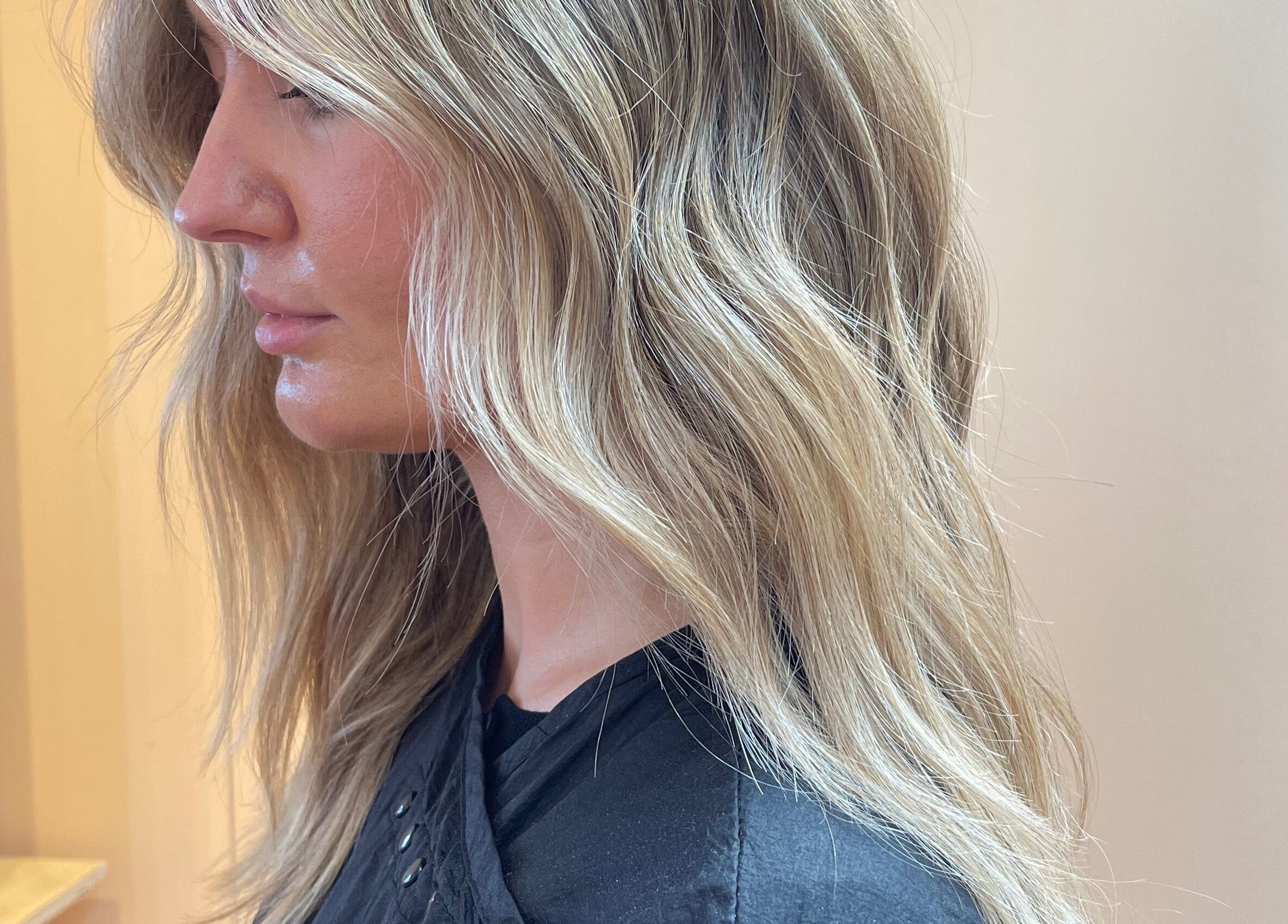 Side view of blonde hair waves styled at Imogen Coates, London, England, GB salon.