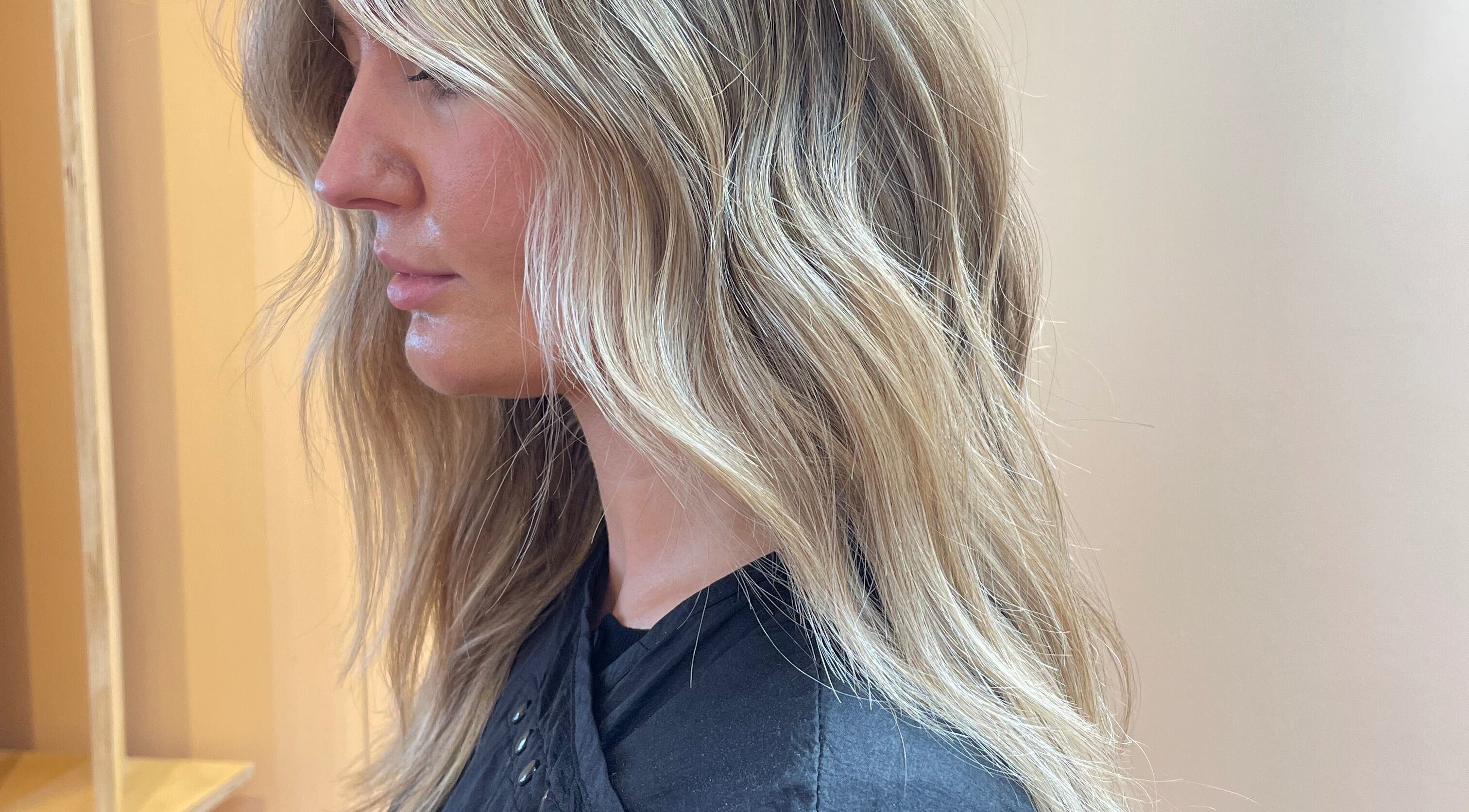 Side view of blonde hair waves styled at Imogen Coates, London, England, GB salon.