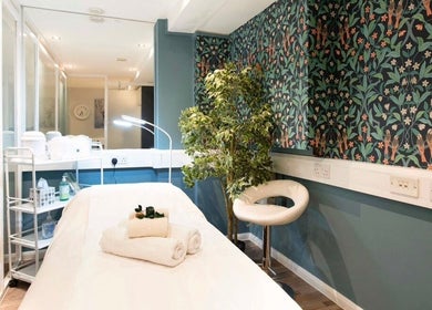 Luxurious treatment room at Anir Anun Clinic in London, England, GB, with elegant decor and fresh towels.