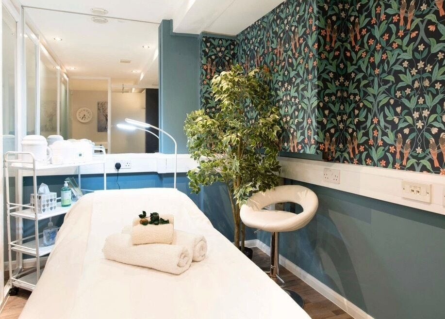 Relaxing spa room at Anir Anun Clinic in London, England, GB, featuring vivid, floral patterned walls.