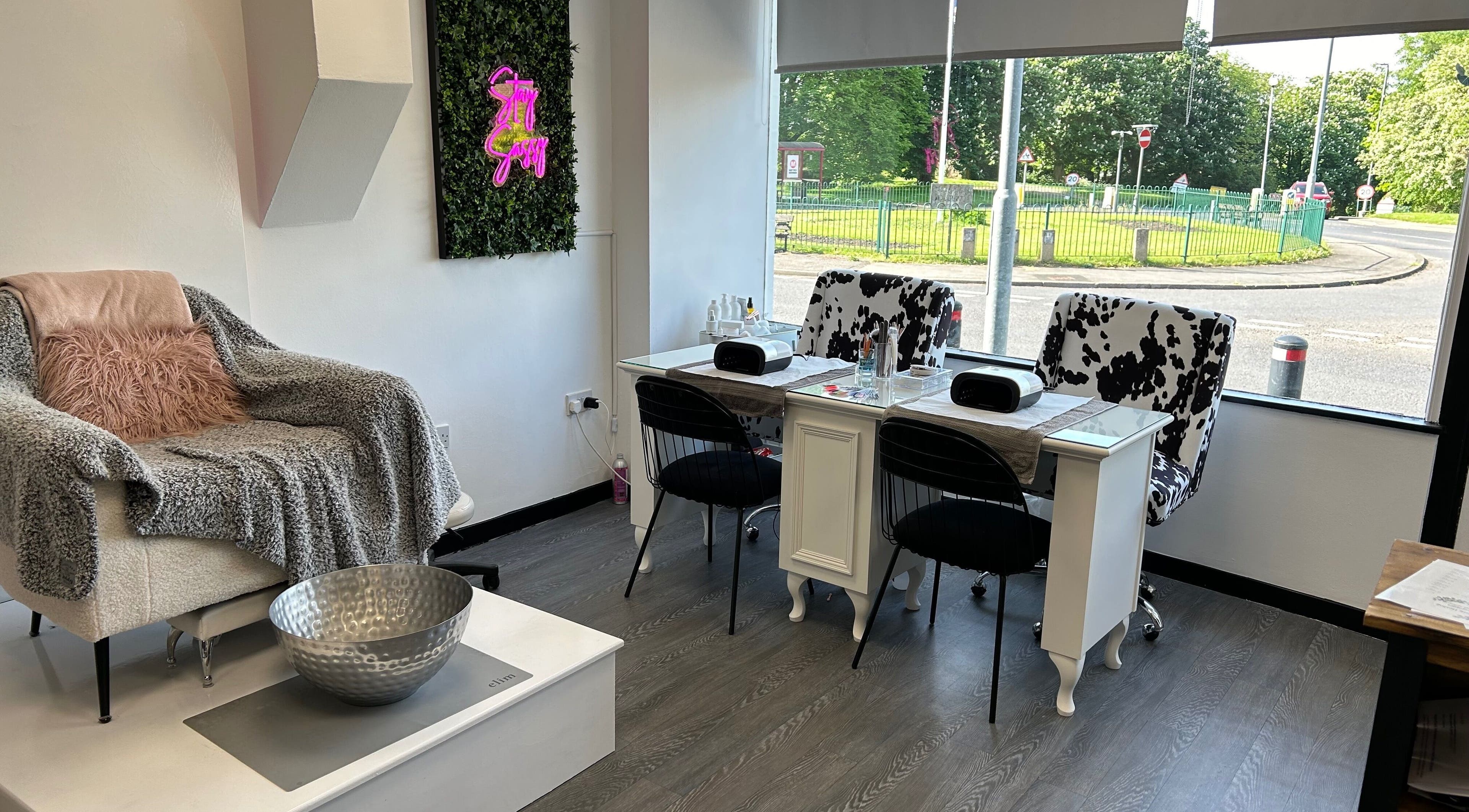 Relaxing spa chair and nail station at Brier Lane Beauty, Wakefield, England, GB, with a vibrant street view.