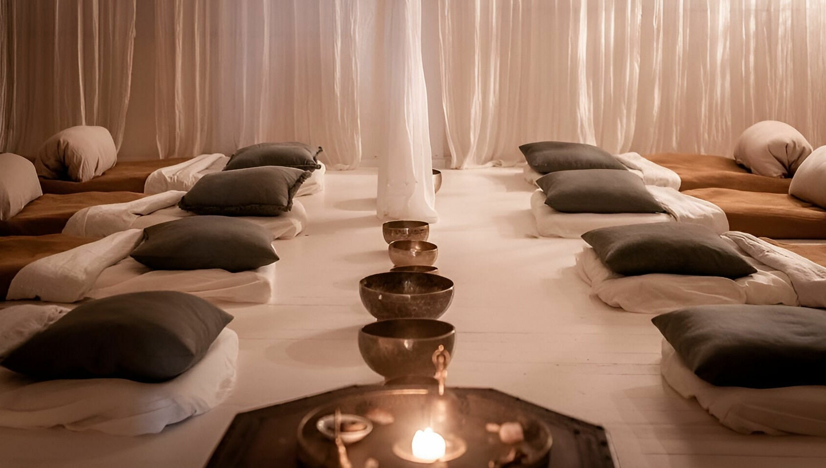 Tranquil meditation room at Chakana Day Spa + Wellbeing in Avalon Beach, New South Wales, AU, with cozy cushions.
